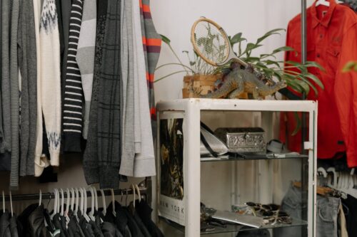 assorted clothing hanging in the clothing racks
