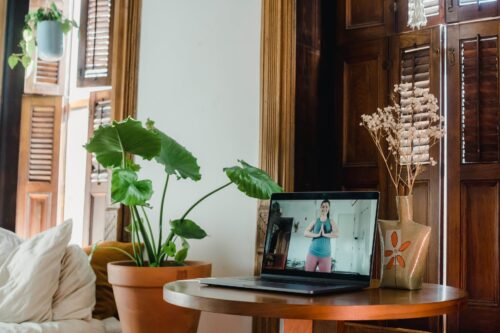 woman doing online yoga class