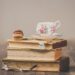 photo of teacup on top of books